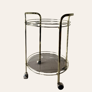 gouden bijzettafel met gerookt glas voor bruiloft styling